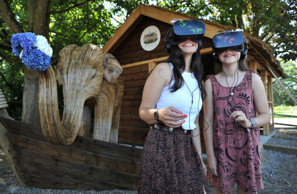 two women wearing VR headsets standing outside sudeley castles animal ark VR experience